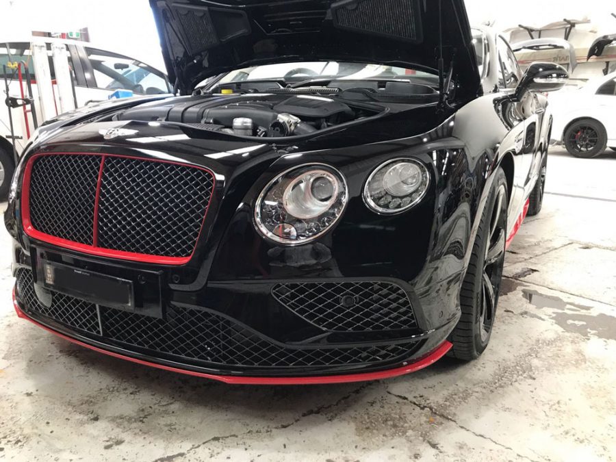 a bentley in the panel shop