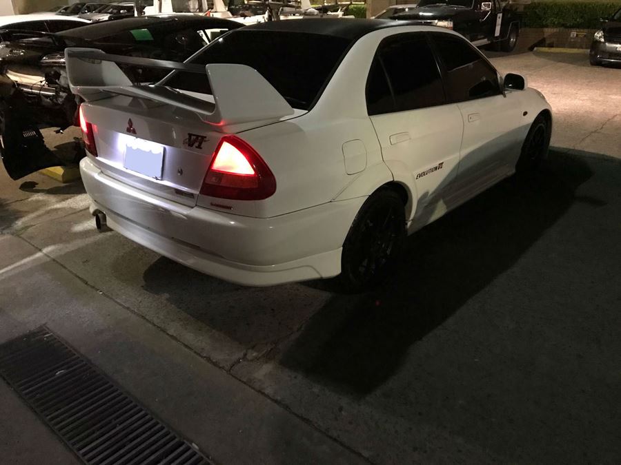 White Mitsubishi at Basha White Mitsubishi smash repairs